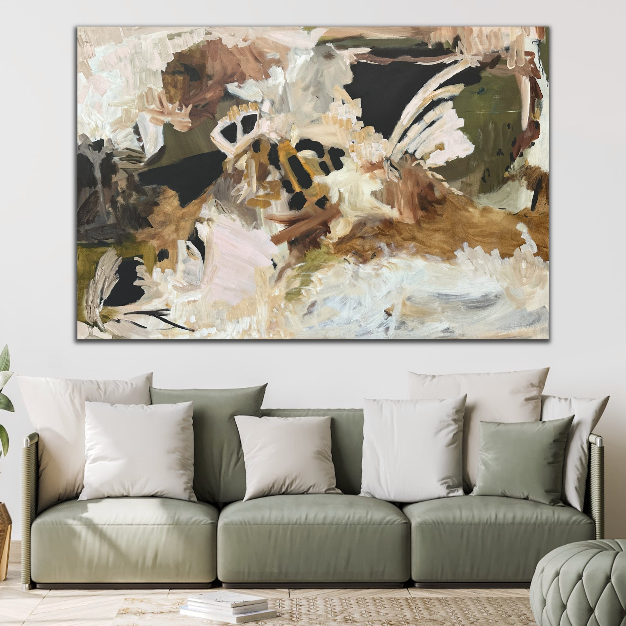 Contemporary abstract painting hanging above a sofa in a living room