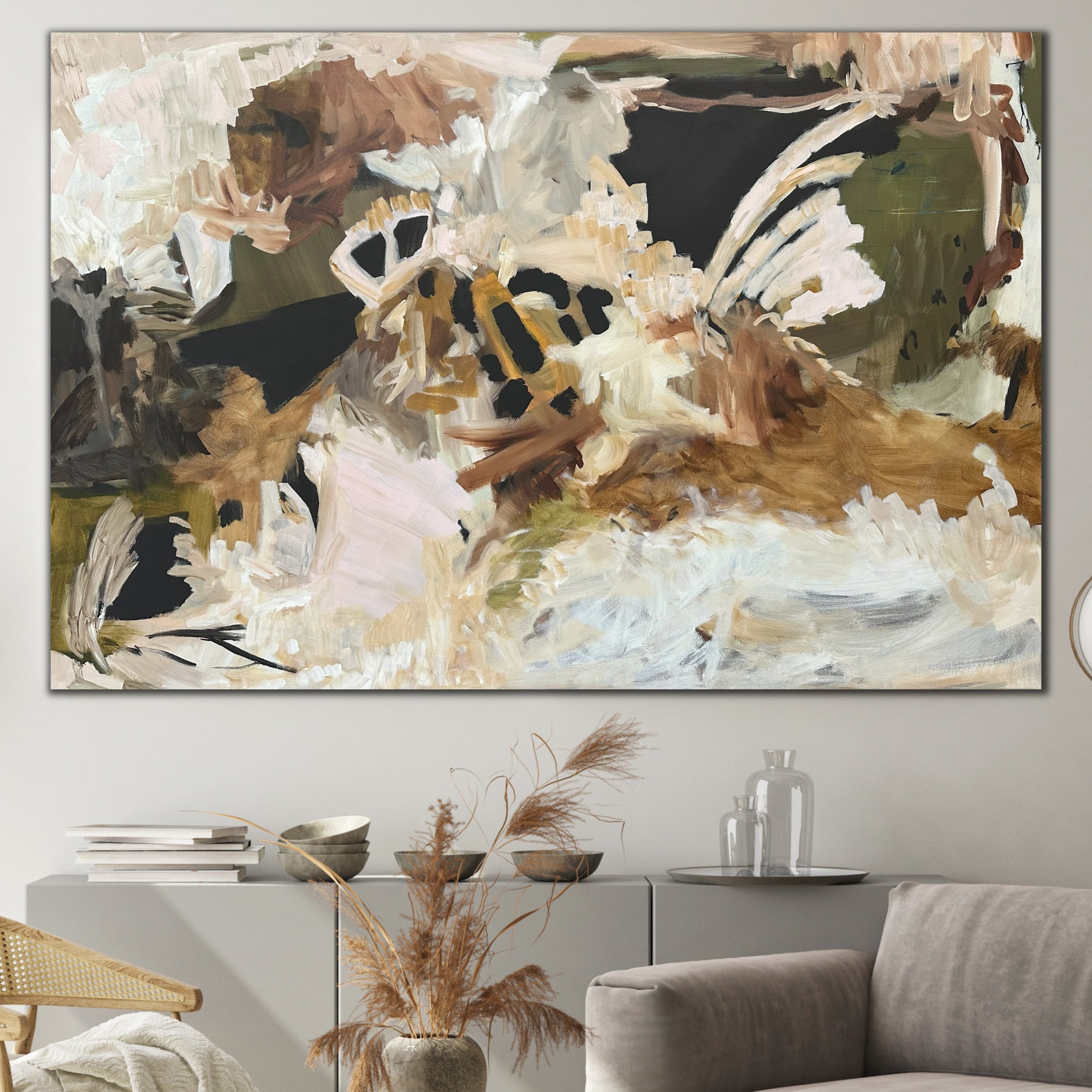 Large abstract painting in natural tones in a modern neutral living room setting