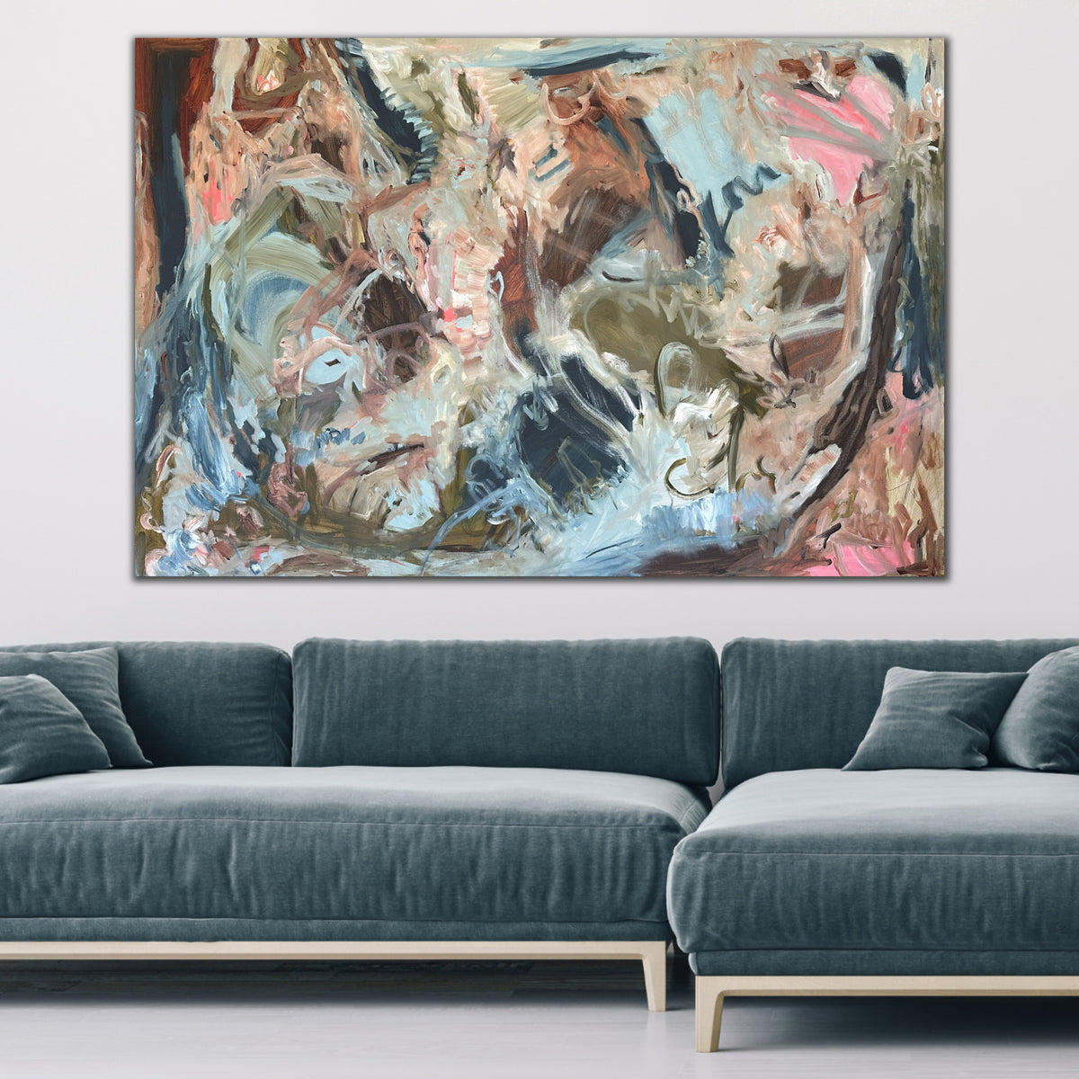 A large abstract painting hanging on wall in contemporary living room.