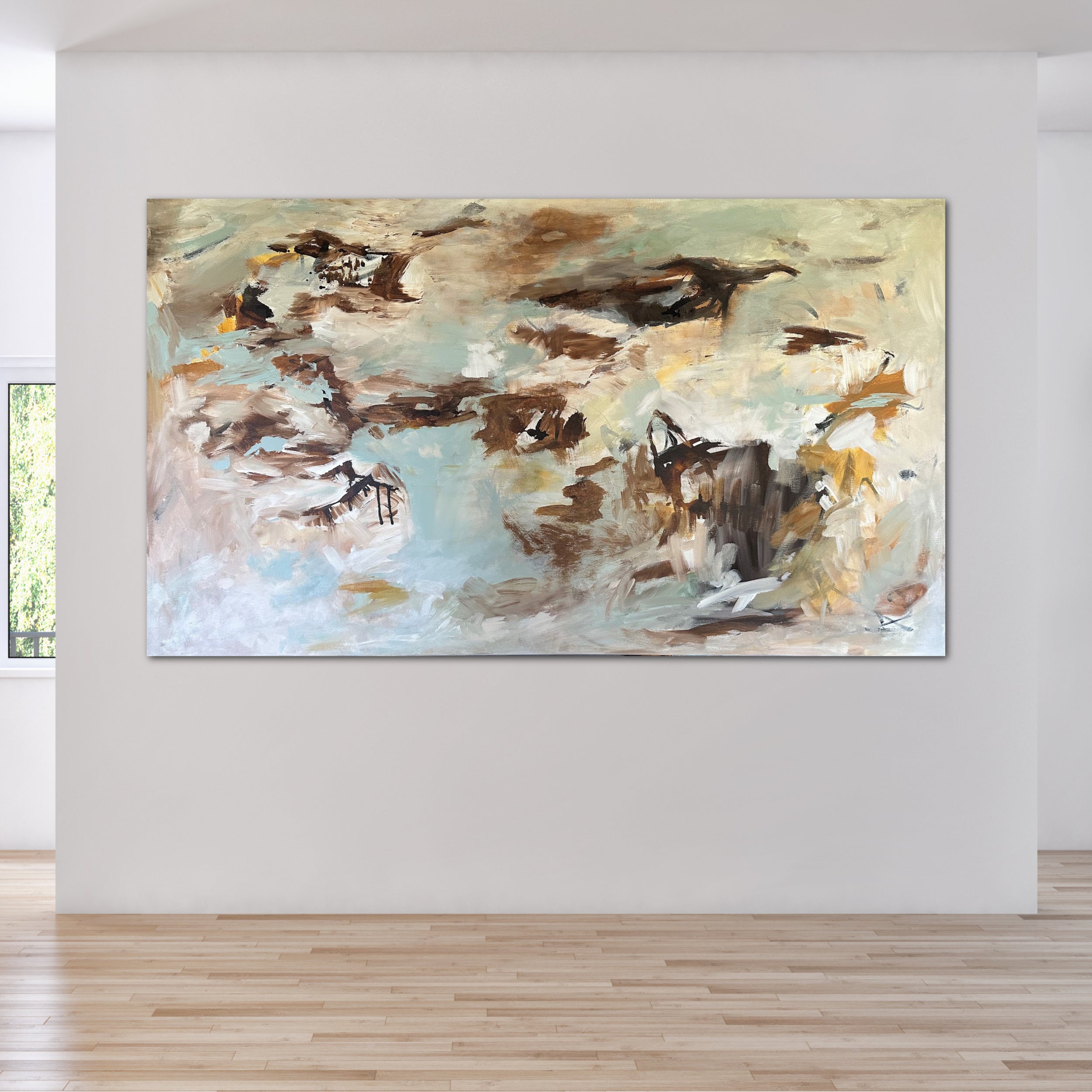 Oversized abstract expressionist painting in light blue, brown, white and beige hanging on wall in modern home