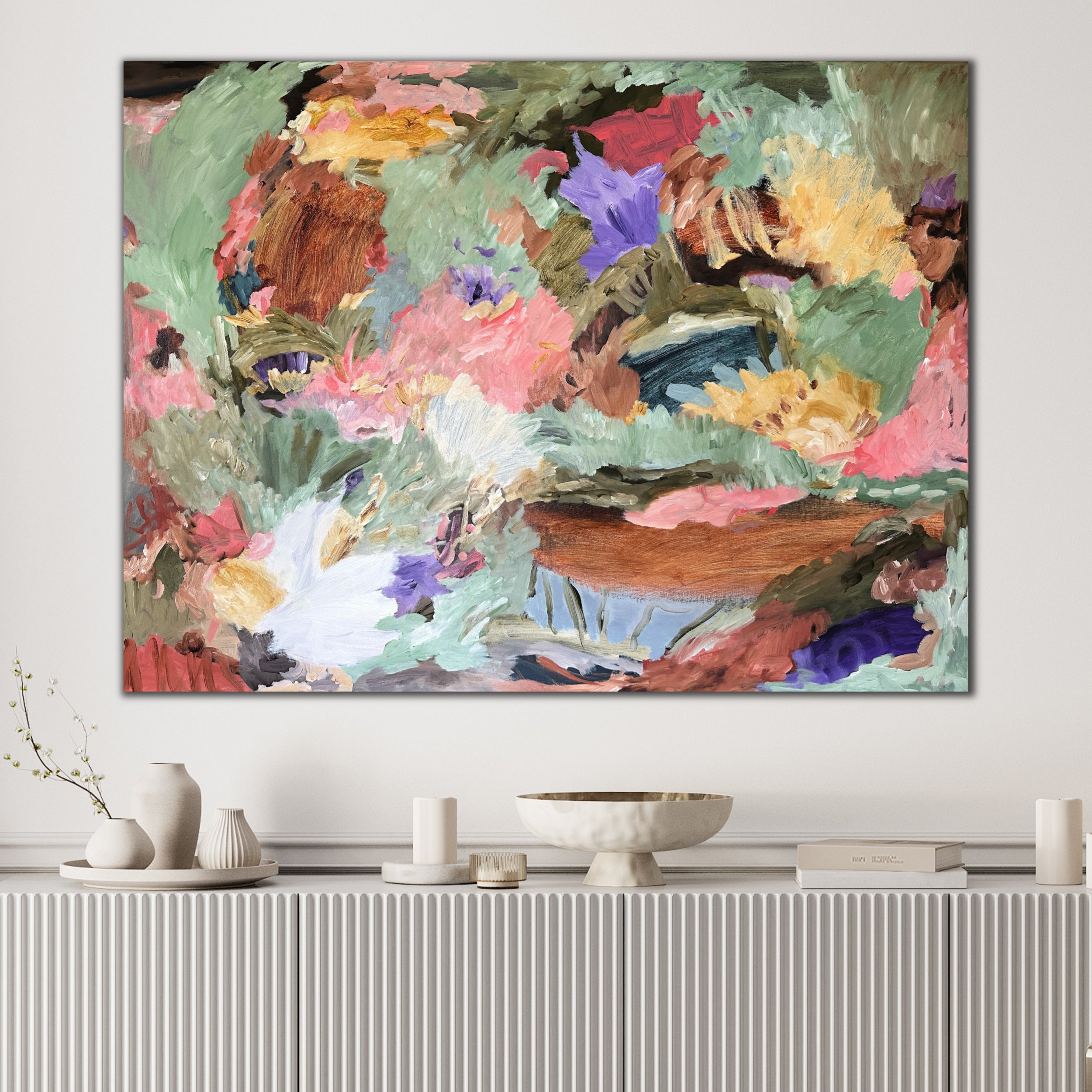 Expressive abstract painting alluding to a colourful landscape hanging in contemporary designer home