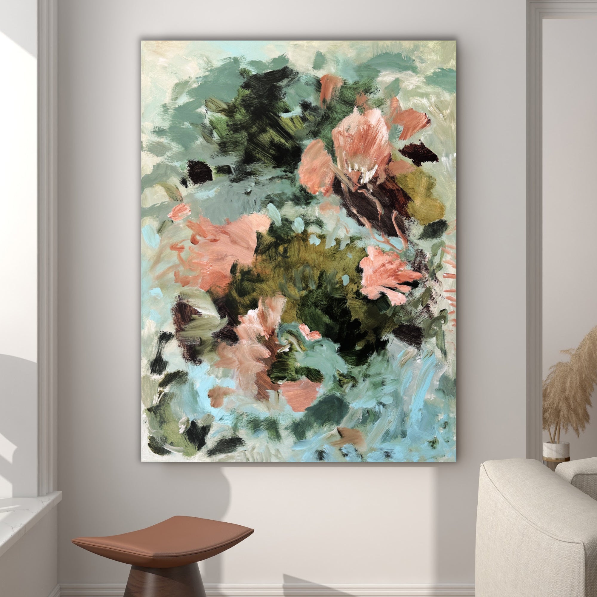Gestural, abstract painting inspired by nature and flowers hanging in a modern living room setting