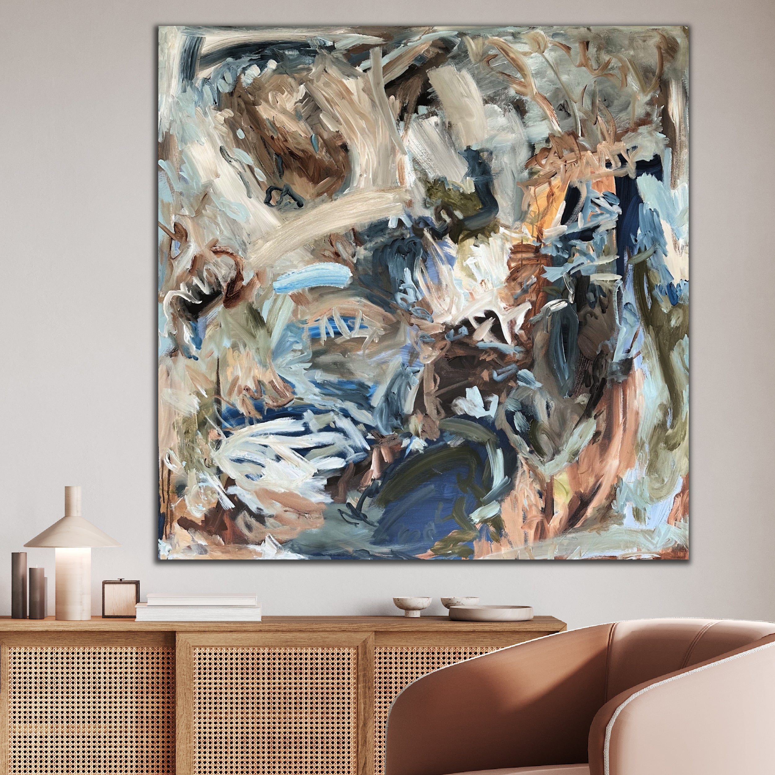 Contemporary abstract artwork with wild, energetic brushtstrokes and mark-making, hanging on wall in living room of modern home