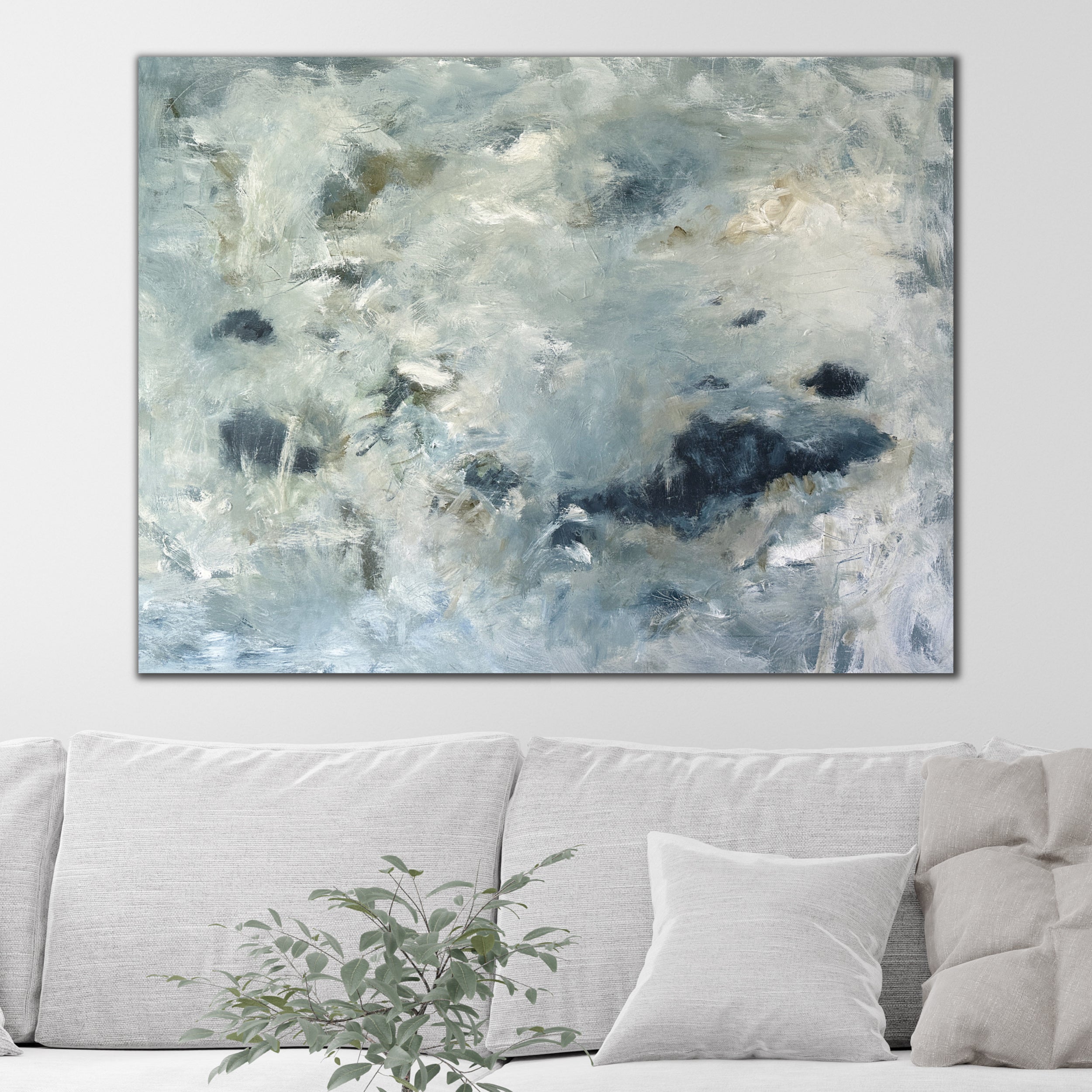 Expressive abstract painting hanging above neutral sofa in modern living room