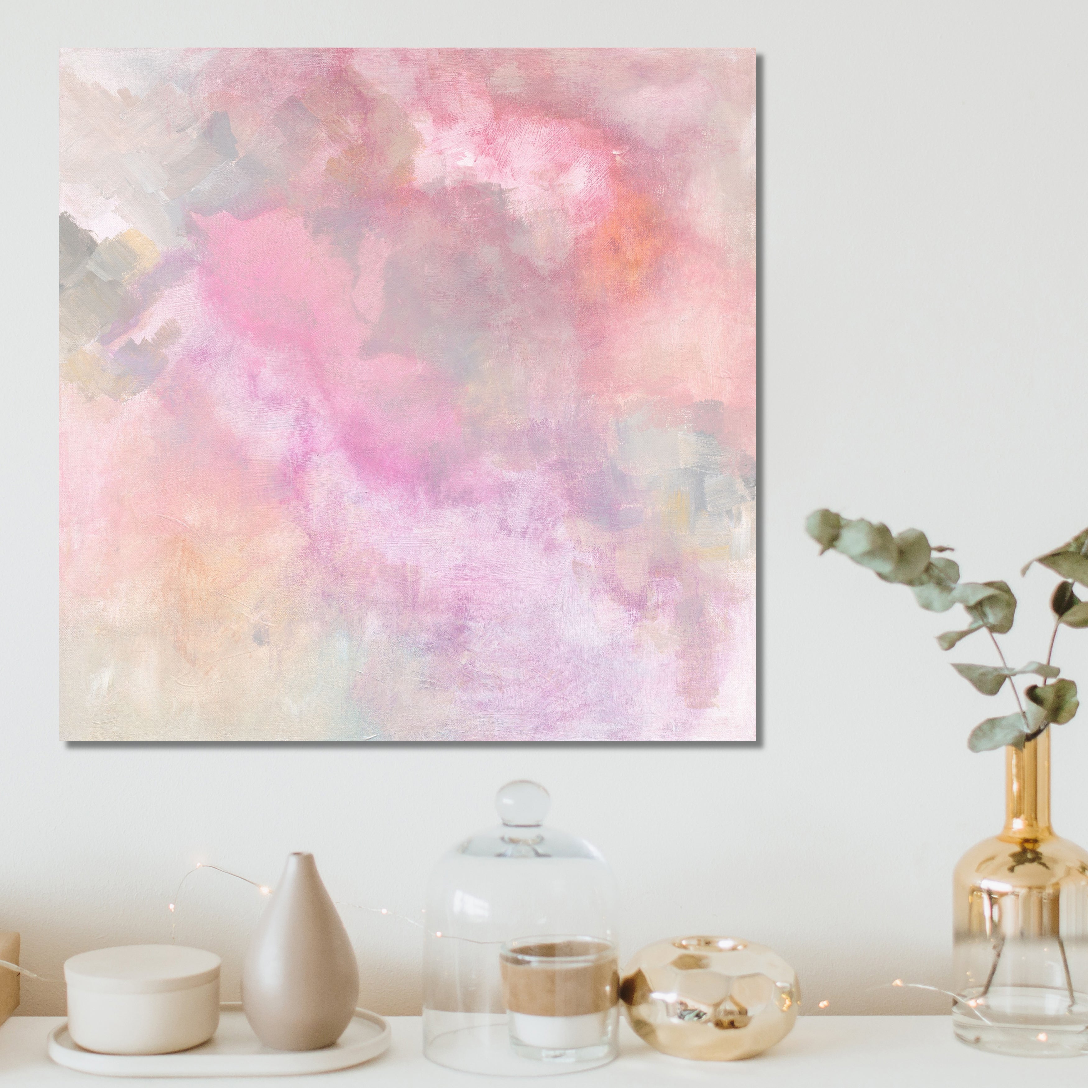 Soothing abstract painting "Ethereal 1" in soft pink and muted colours that alludes to magic, clouds or the sky - hanging in a modern, neutral home interior - insitu