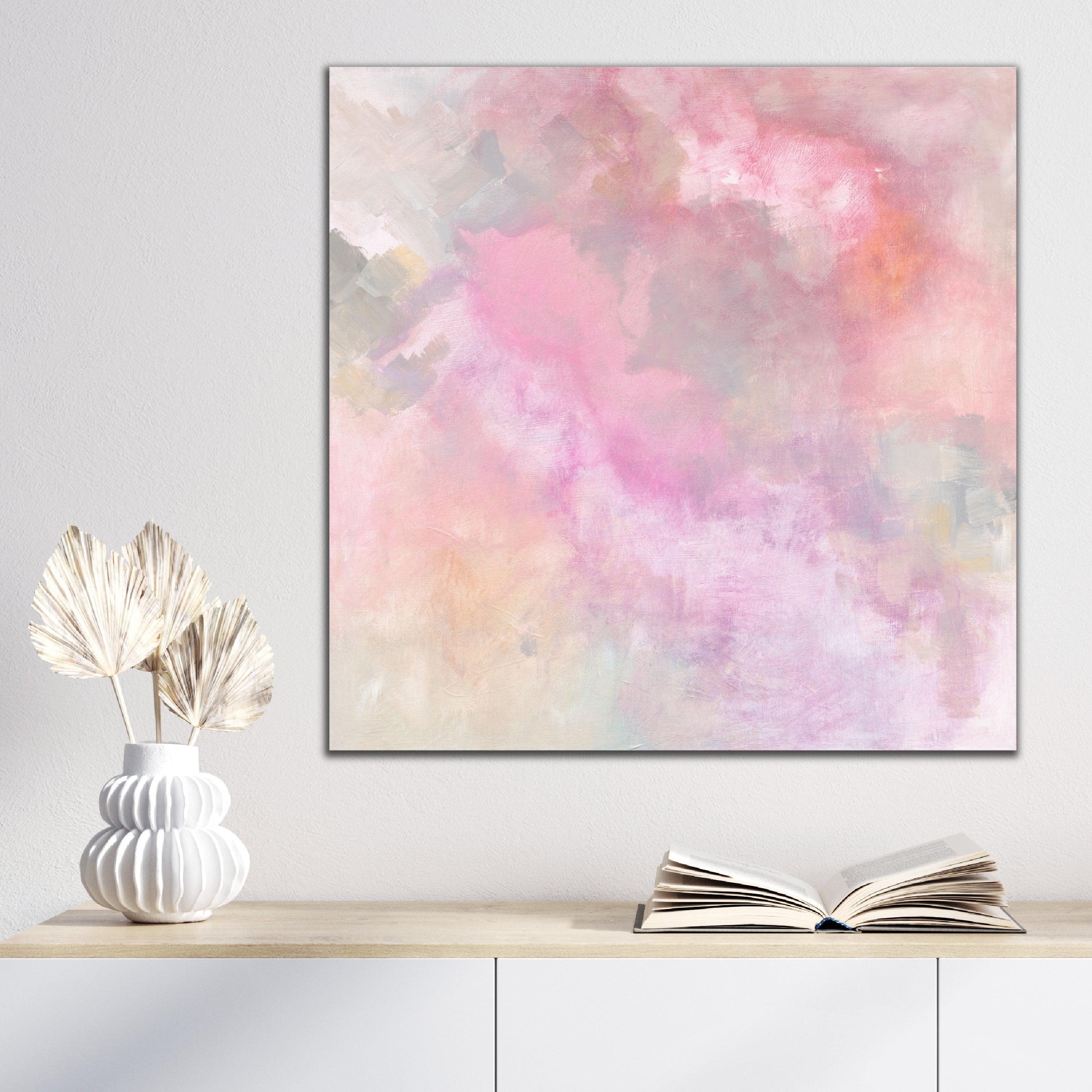Square abstract painting in soft pastel colours hanging in a tranquil, modern home interior with natural finishes - in situ