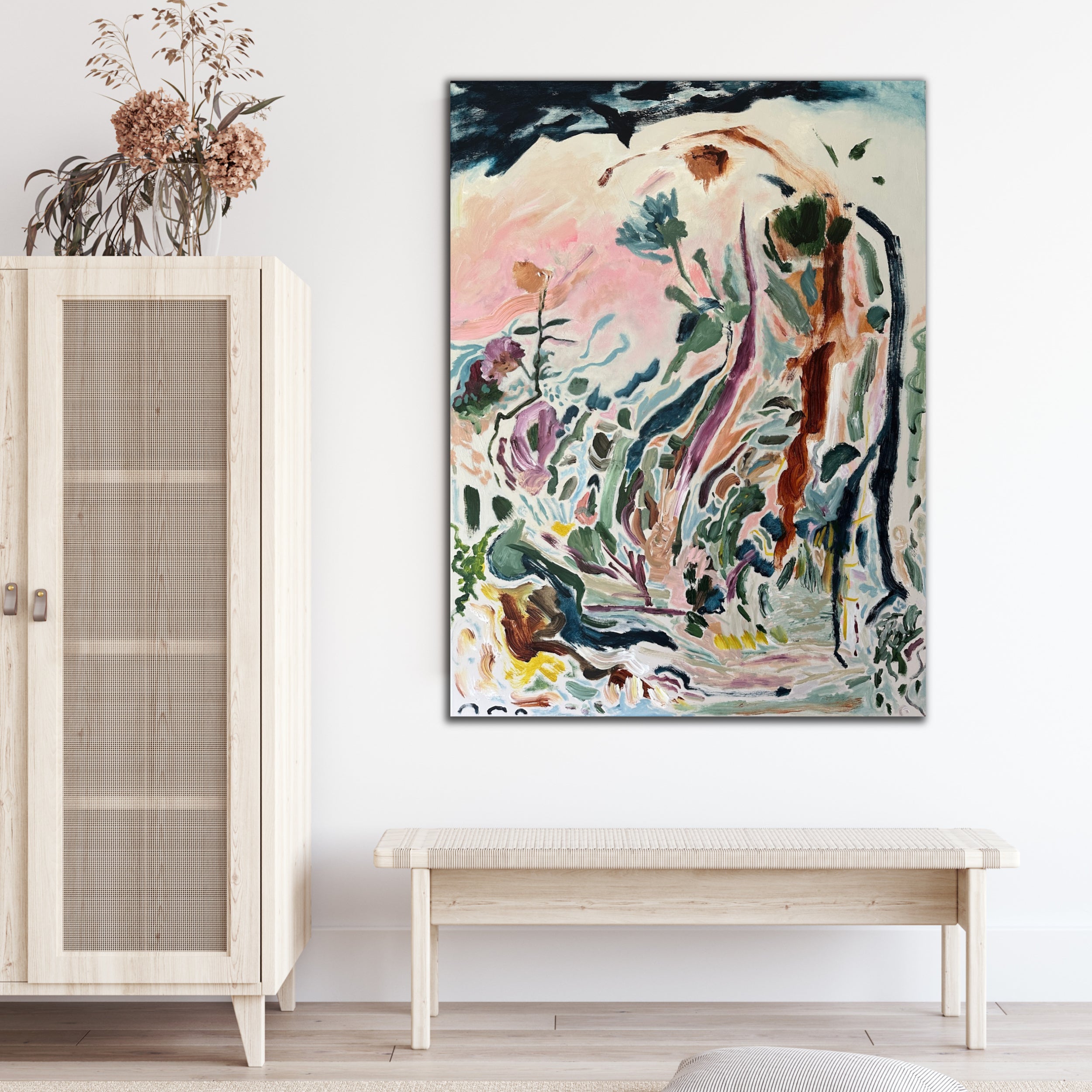 Abstract expressionist artwork "Frolic In The Bloom" inspired by a garden filled with plants and flowers hanging in entry way of modern home with natural decor