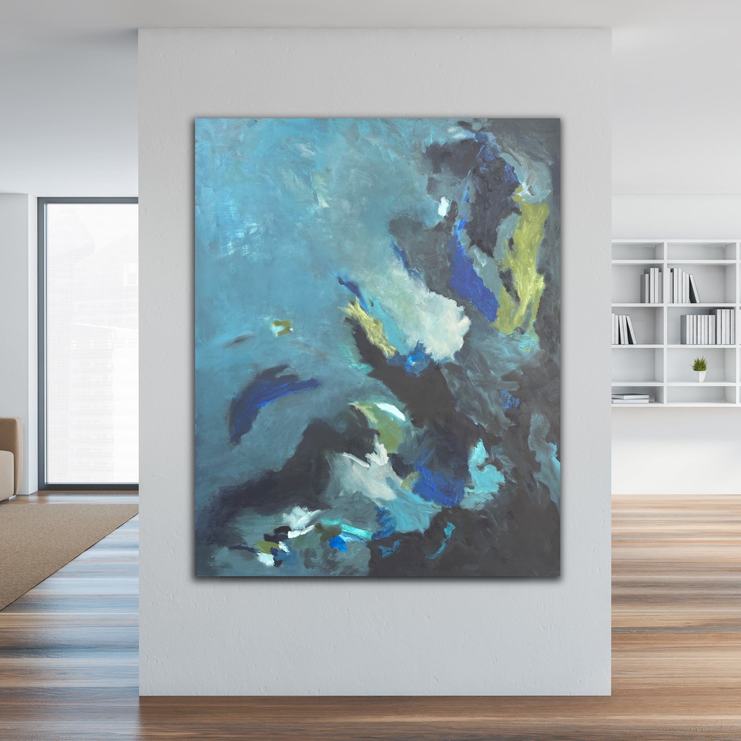 Large blue and green abstract painting on canvas hanging on wall in neutral modern home interior