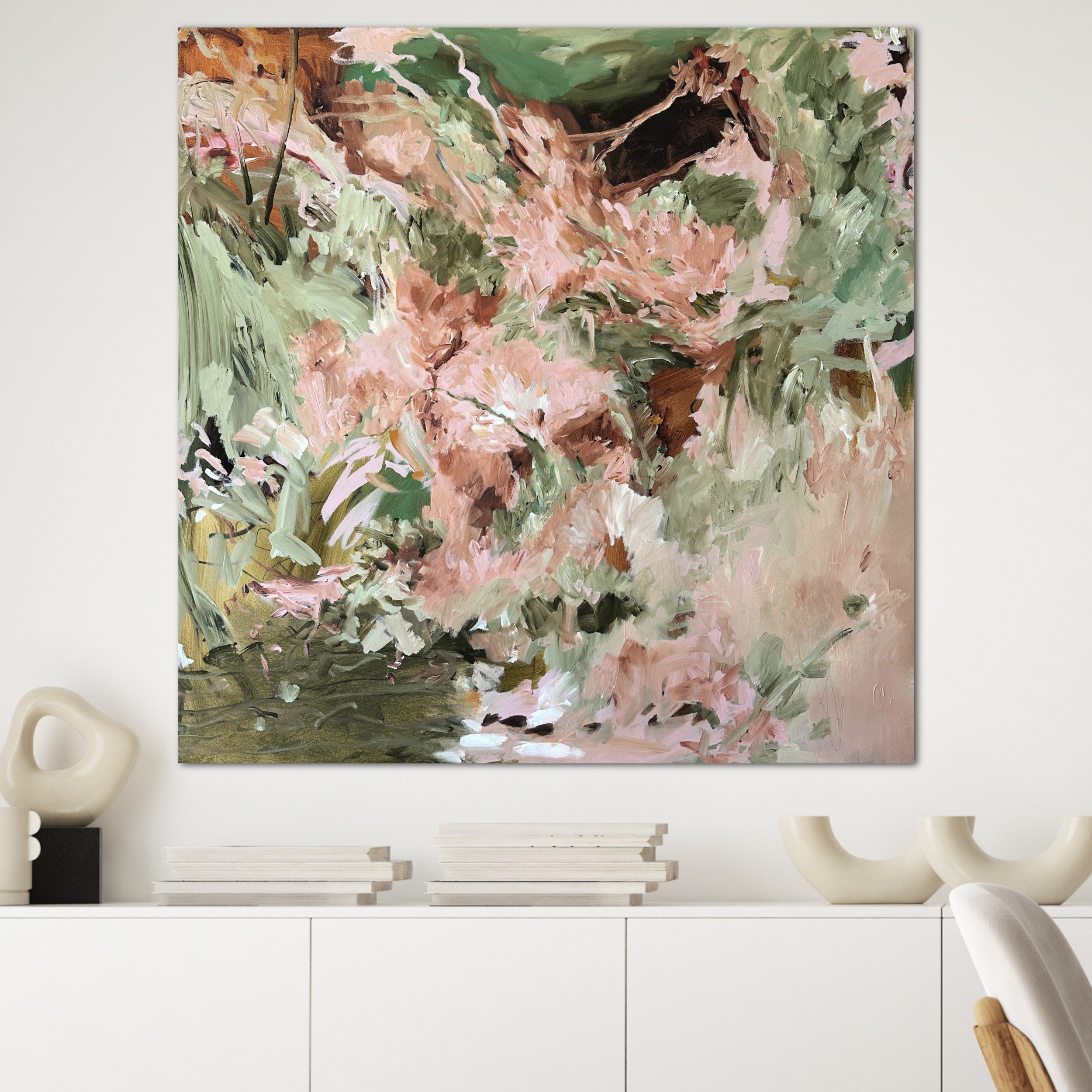 Nature inspired abstract painting hanging on wall in minimalist modern home