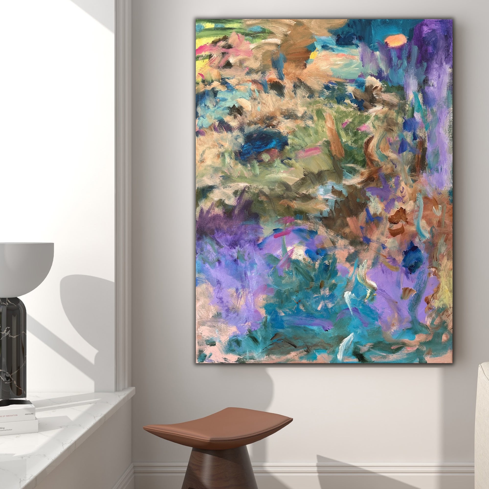 Interior setting with abstract artwork on wall, showing expressive colour layers creating atmosphere and energy.