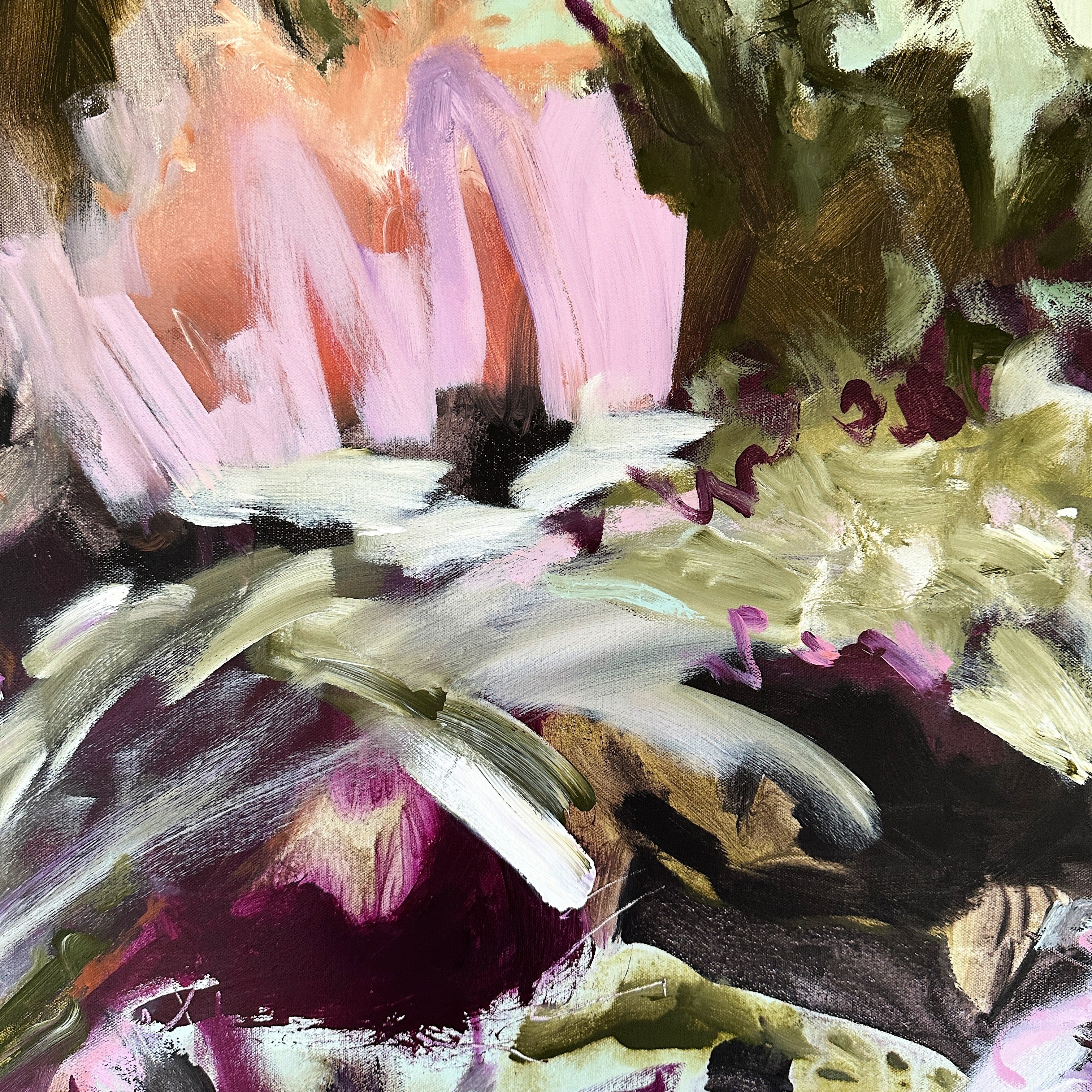 Close-up detail or swatch of energetic abstract painting on canvas showing expressive brushstrokes on canvas in green, pink and eggplant colours