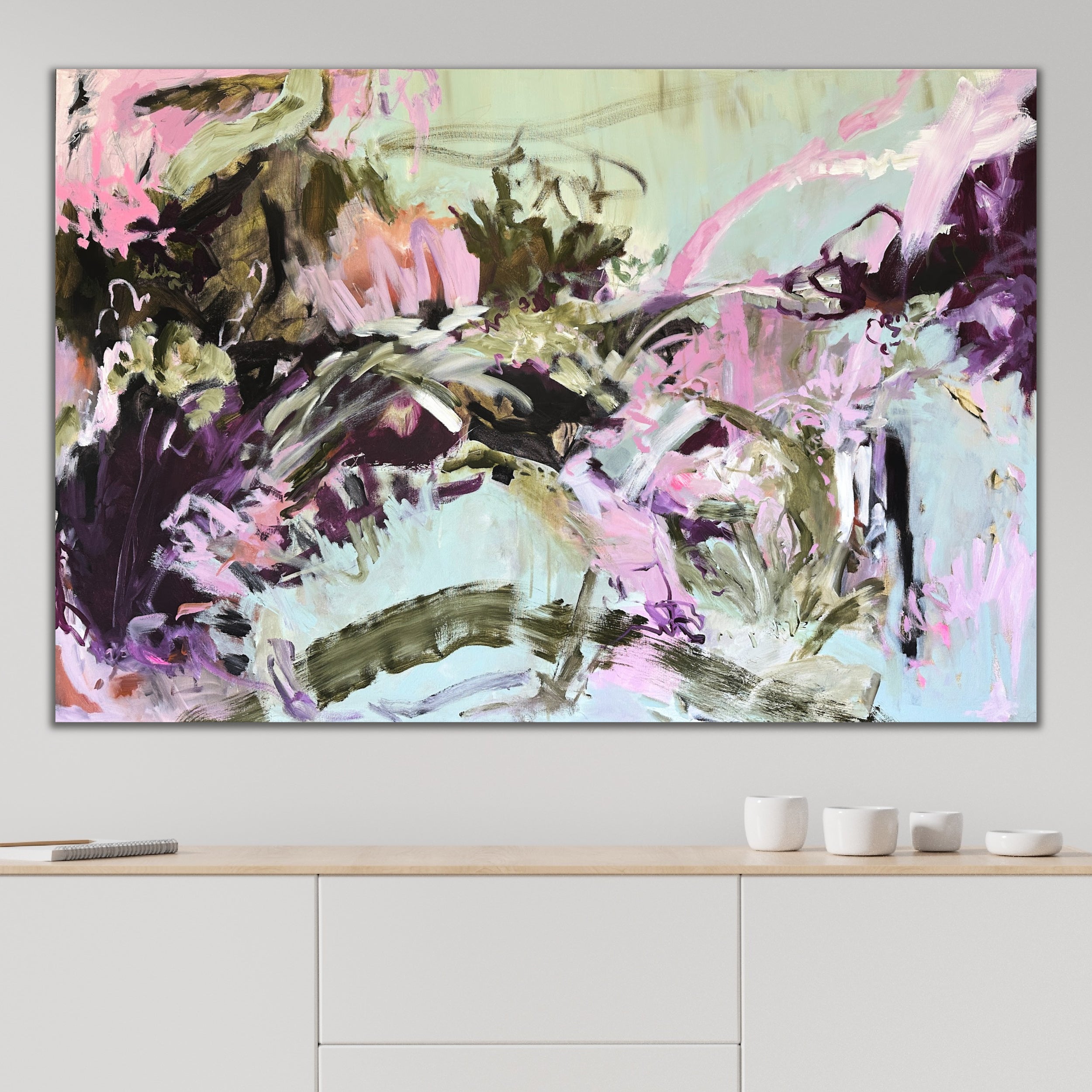 Contemporary abstract artwork in abstract expressionist style hanging on wall in dining room of modern home