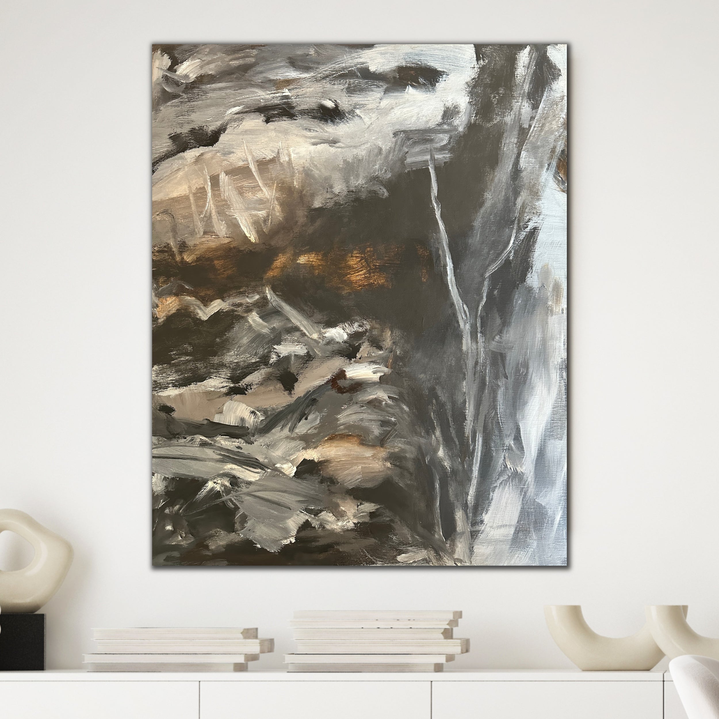 Grey, brown and black abstract painting hanging in modern interior living room