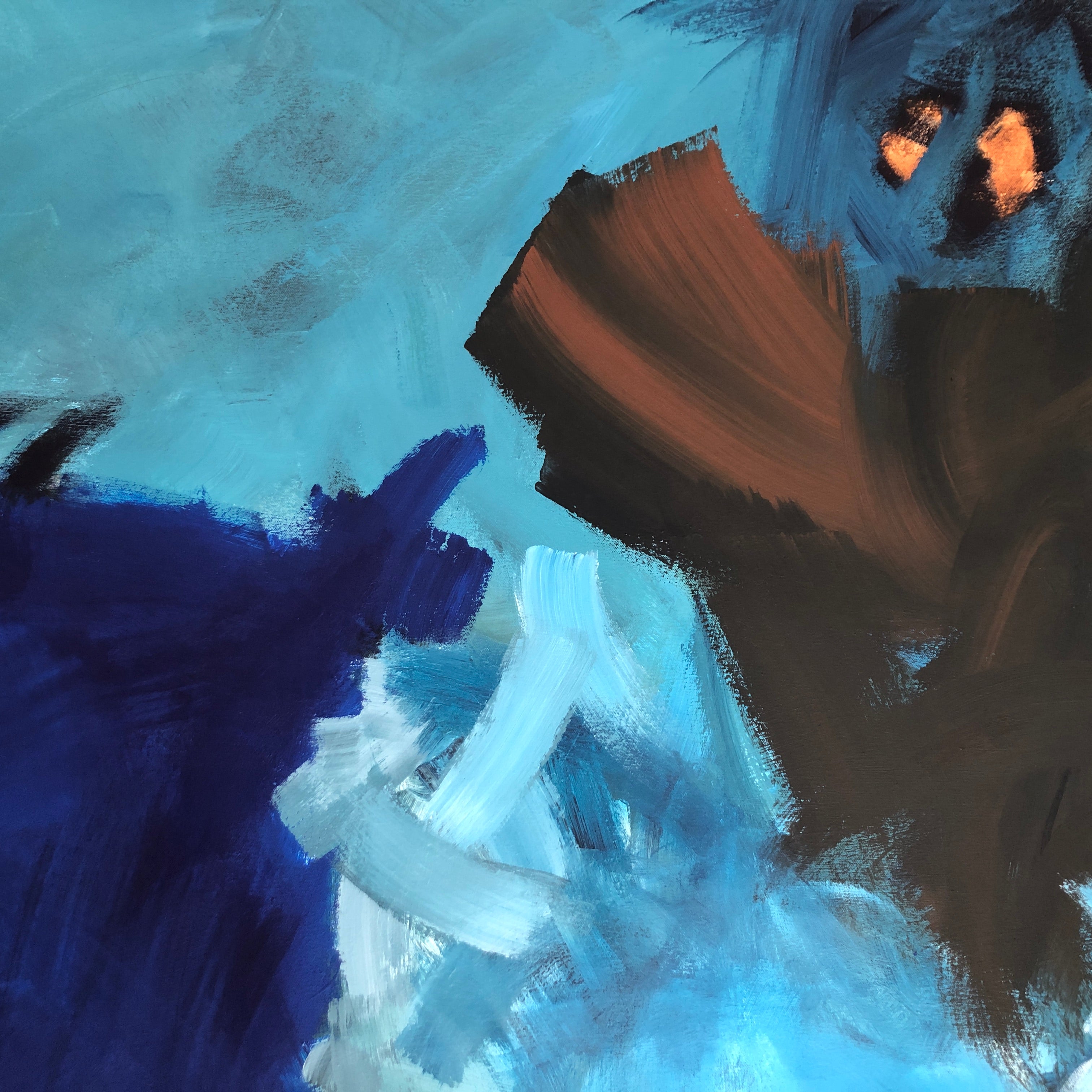 Close-up detail of bold blue and brown abstract painting with expressive brushstrokes