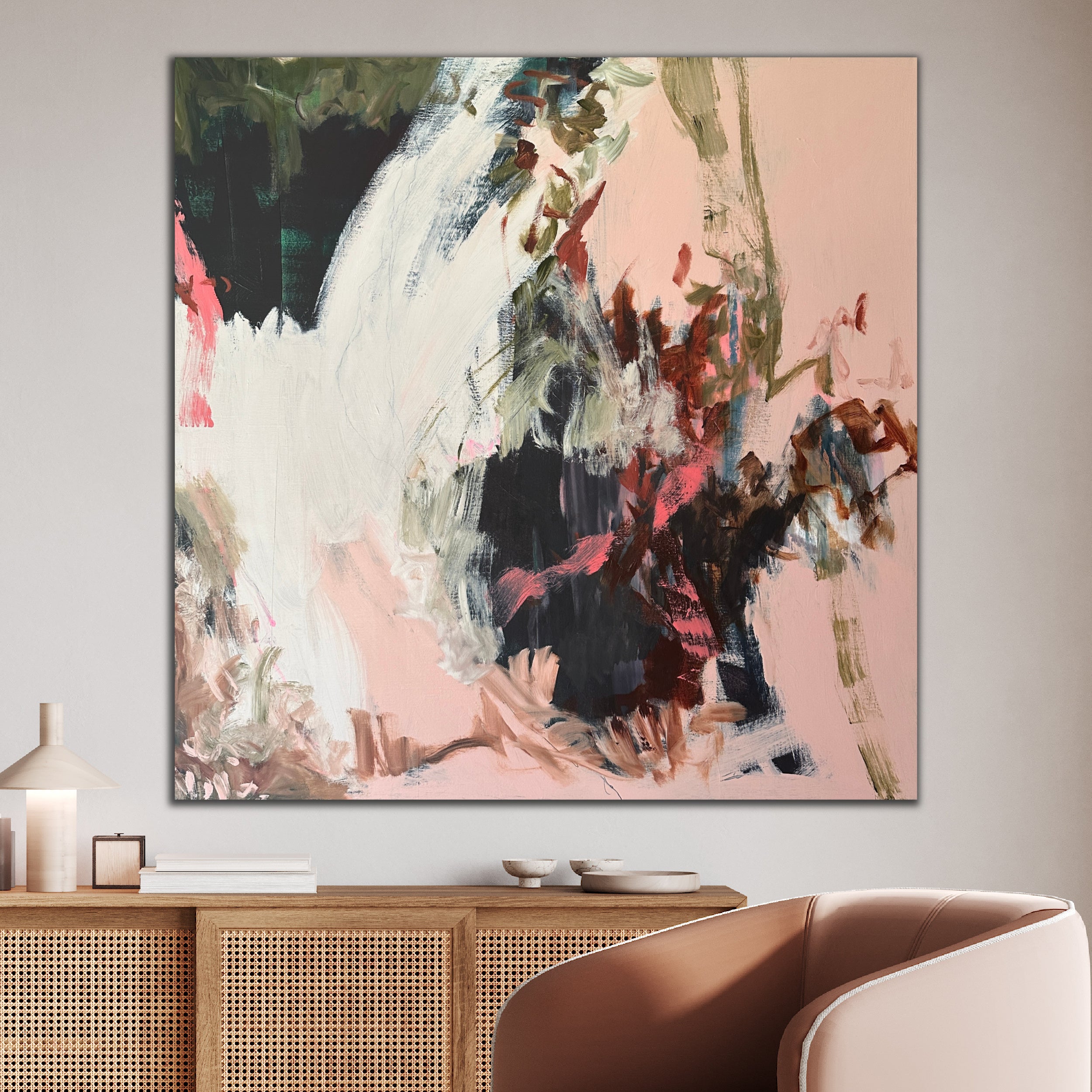 Large, square abstract painting hanging on wall in modern, neutral living room