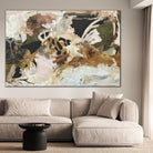 Abstract painting 'Her Kind Nature' by Kylie Sams hanging on a wall above a beige sofa in a living room.
