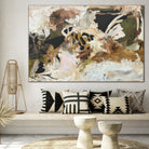 Large expressive abstract painting in earthy tones in a living room 