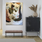 Abstract painting in soft blue and earthy colours hanging on wall in contemporary interior.