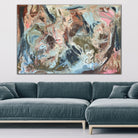 A large abstract painting hanging on wall in contemporary living room. 