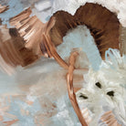 Close-up detail of an abstract painting with expressive brushstrokes in brown, beige, white, and pale blue, featuring organic forms and mark-making.