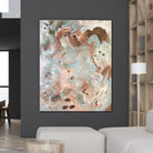 A large abstract painting on canvas with textured brushstrokes in beige, brown, white, olive green and light blue, displayed on a dark gray wall in a modern living room setting.