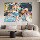 Large expressive abstract landscape painting with botanical elements hanging on wall in modern living room