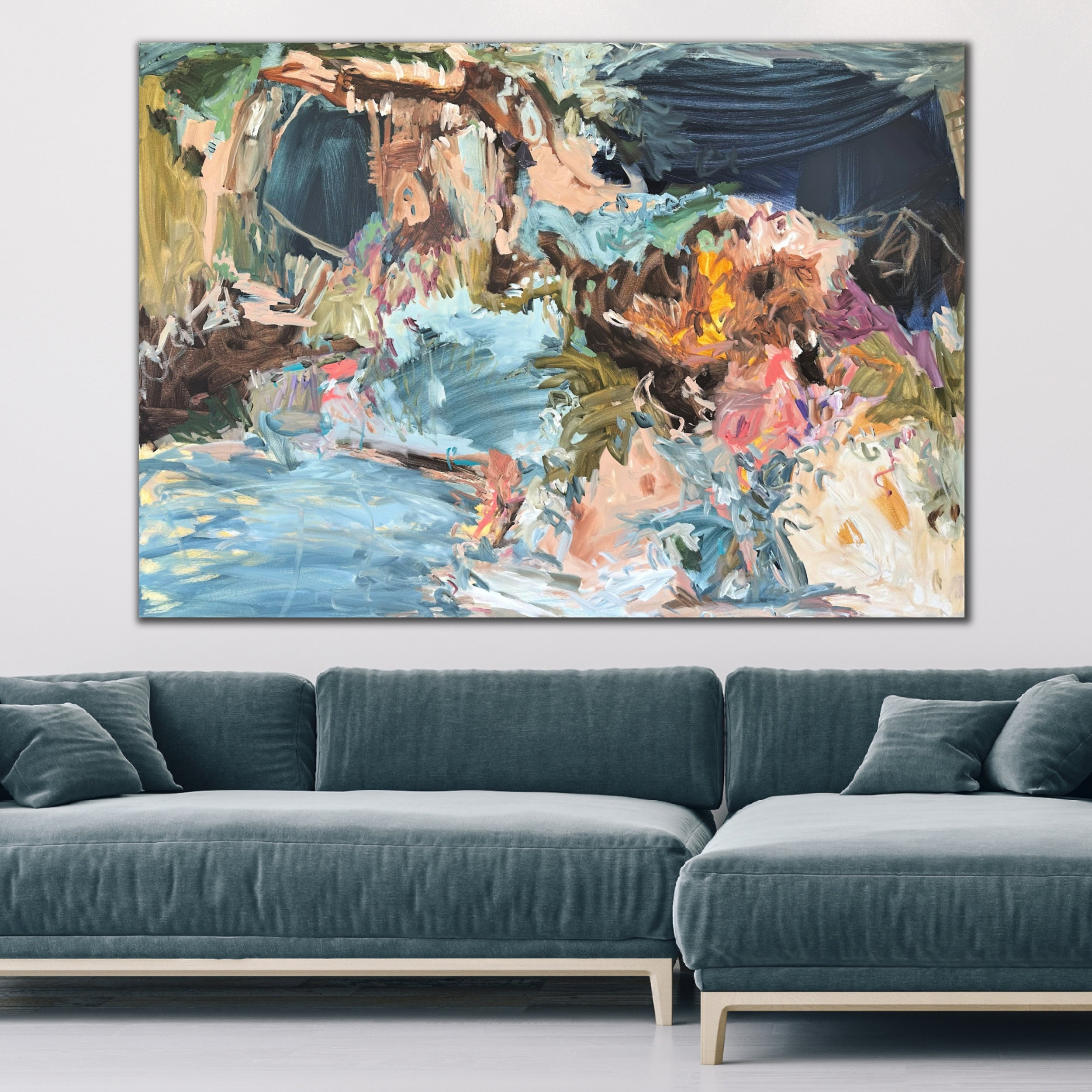 Large colourful abstract painting hanging above sofa on wall in modern living room