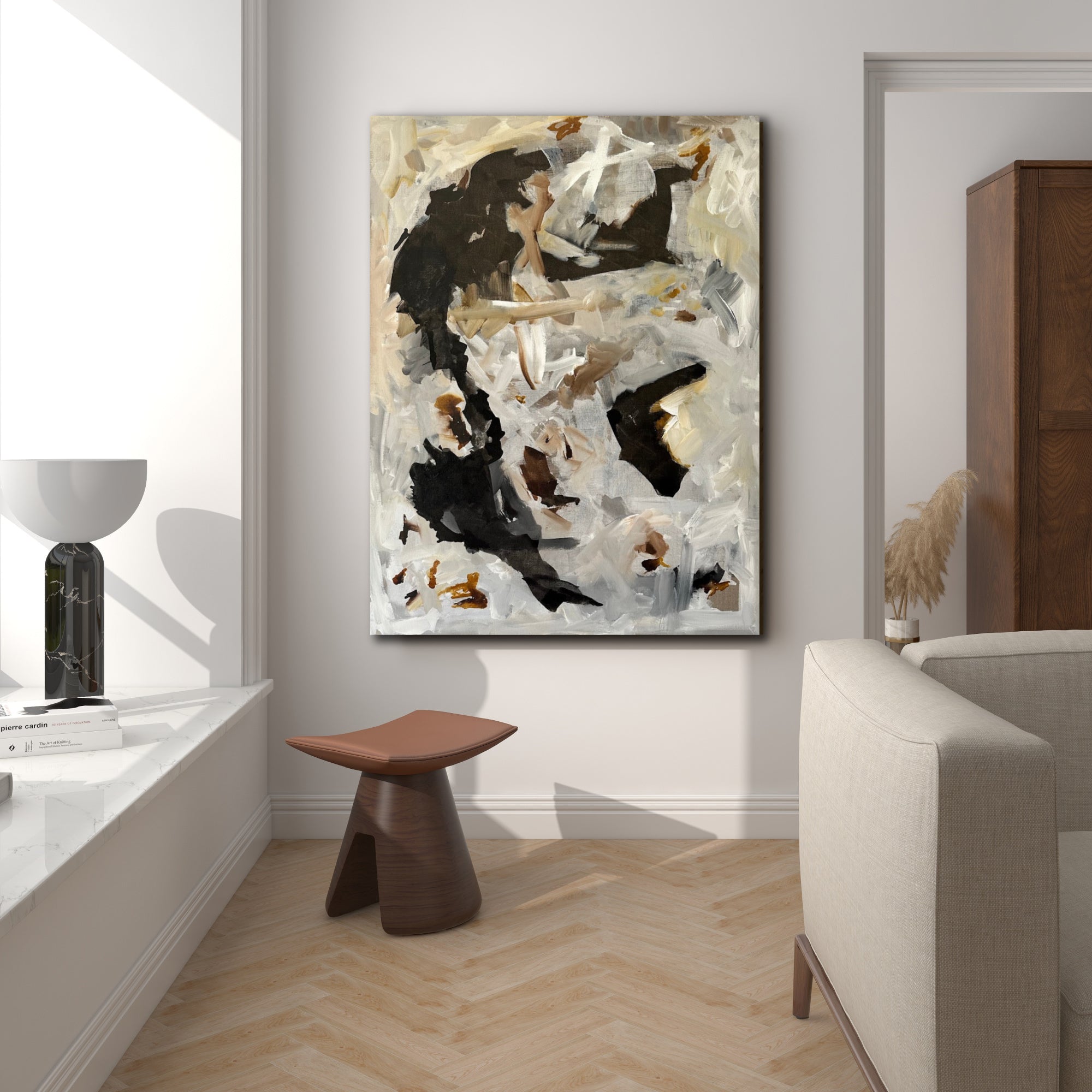 Abstract expressionist painting in black and neutral colours hanging on wall in modern living room with luxury furnishings
