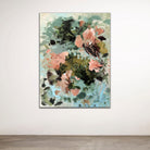 Painterly abstract floral artwork with expressive style hanging on a white wall