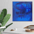 Contemporary blue abstract painting hanging in modern dining room - home interior