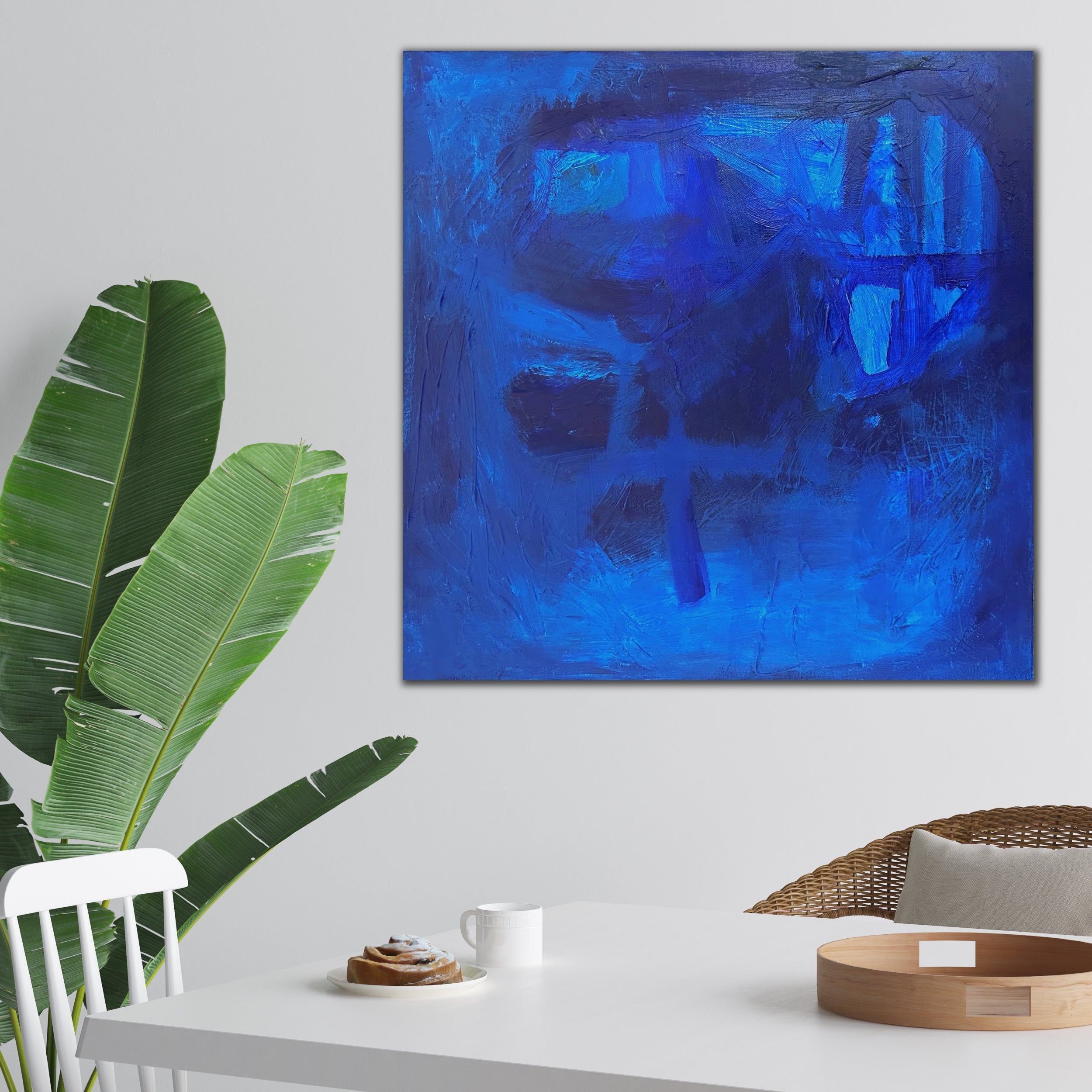 Contemporary blue abstract painting hanging in modern dining room - home interior