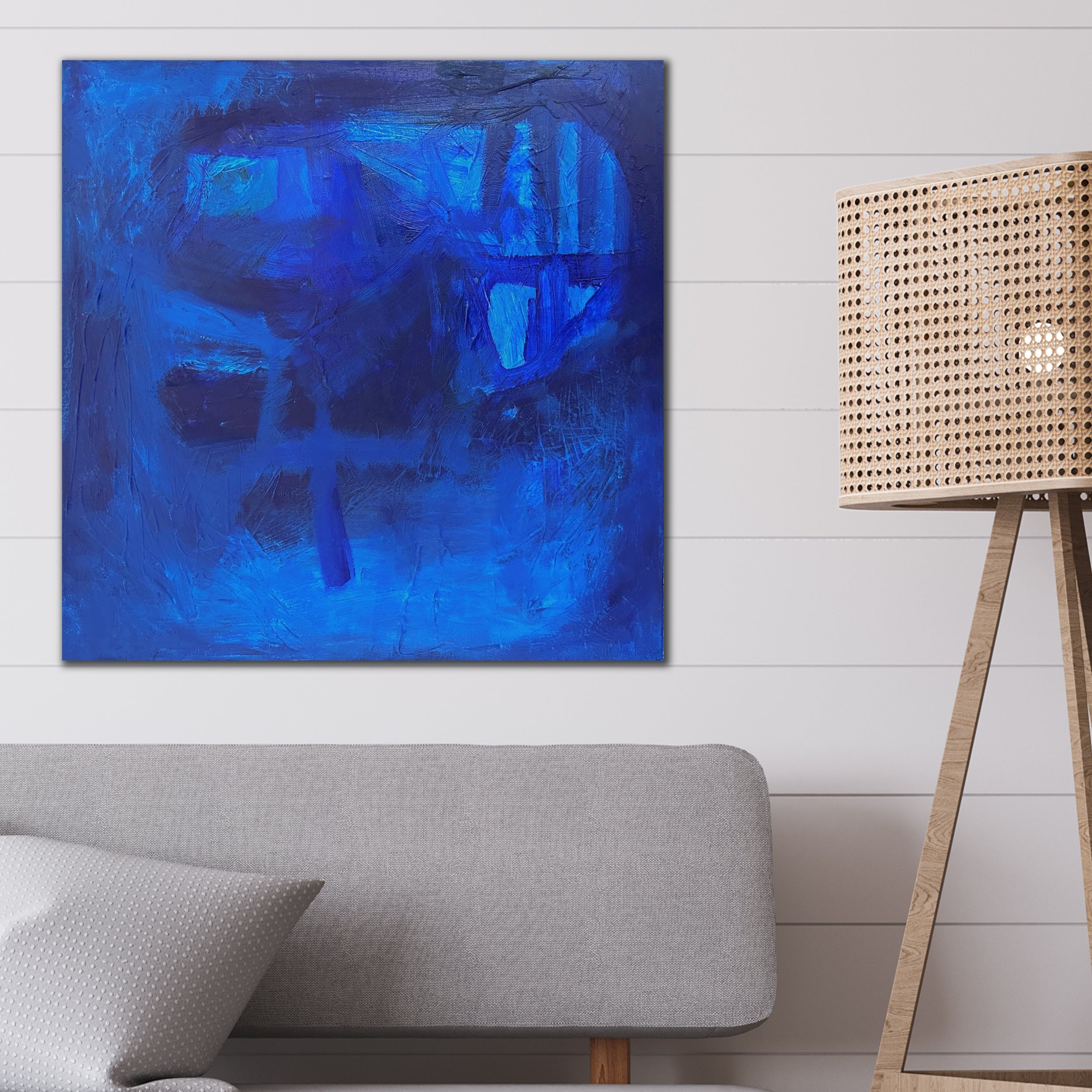 Square blue abstract painting "Beyond The Blue" in contemporary living room - home interior
