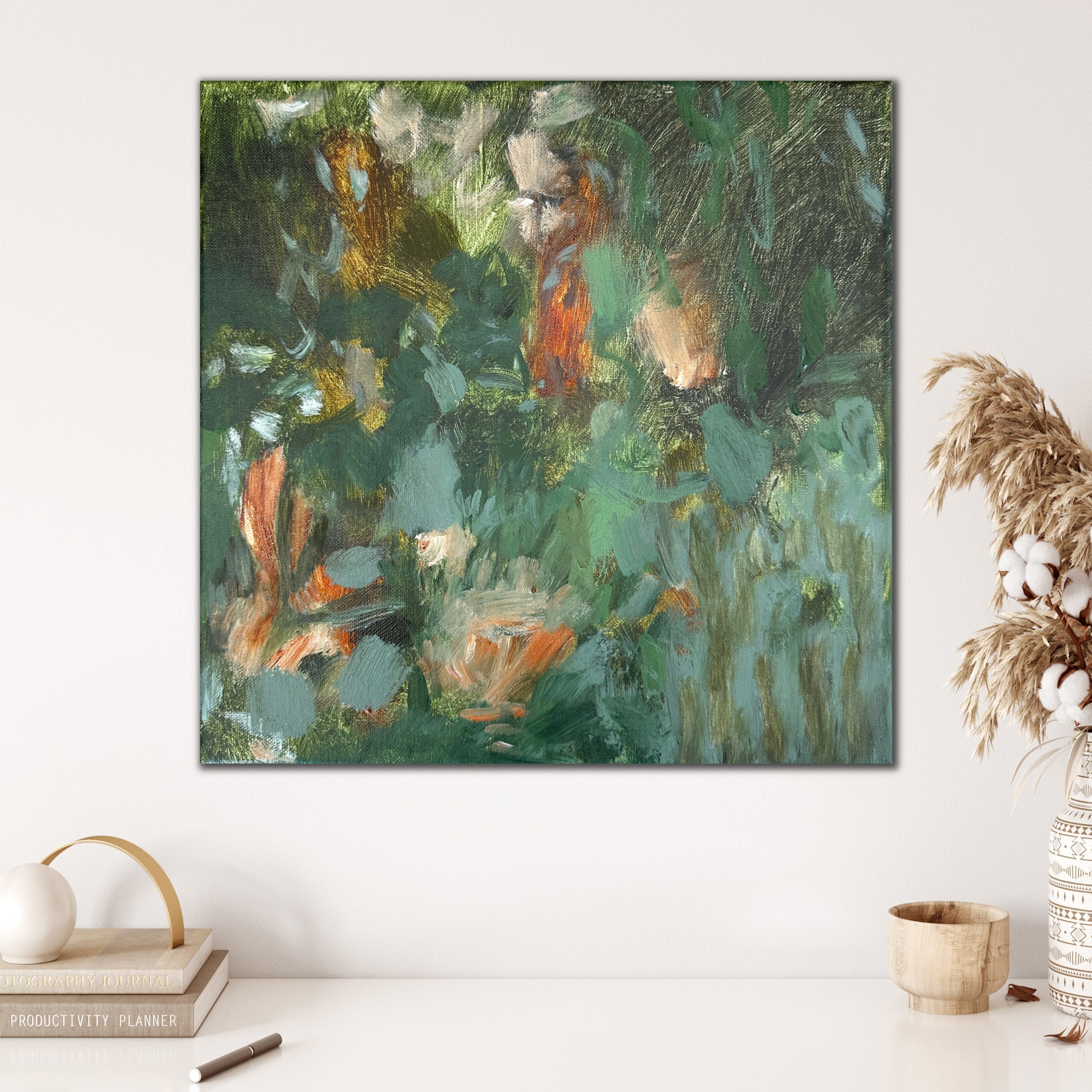 Gestural contemporary abstract painting in green hanging on wall in neutral interior