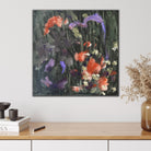 Expressive abstract painting in shades of green, burnt orange, purple and black hanging on wall in modern interior with natural, neutral furnishings and decorative accessories. 
