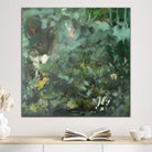 Abstract expressionist painting in green and brown tones hanging on wall in neutral interior 