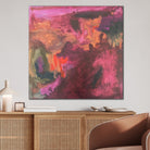 Gestural abstract landscape painting in warm colours hanging in contemporary living room interior with neutral furnishings
