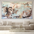 Large statement artwork with expressive, gestural brushstrokes and mark making, hanging in minimalist living room with luxury feel