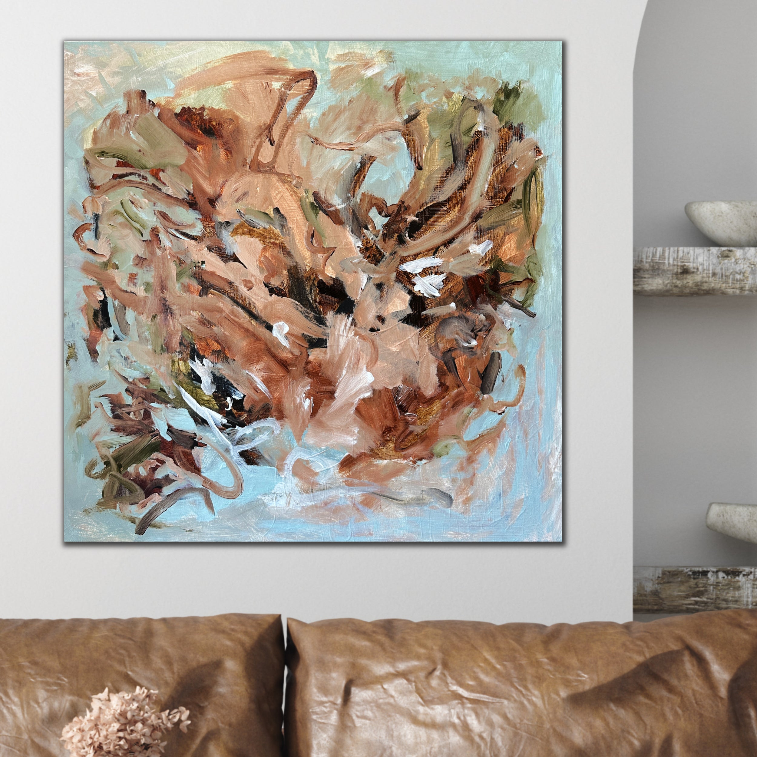 Contemporary abstract floral painting hanging on wall in nature-inspired living room in modern home