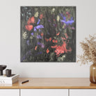 Expressive abstract painting in shades of green, burnt orange, purple and black hanging on wall in modern interior with natural, neutral furnishings and decorative accessories.