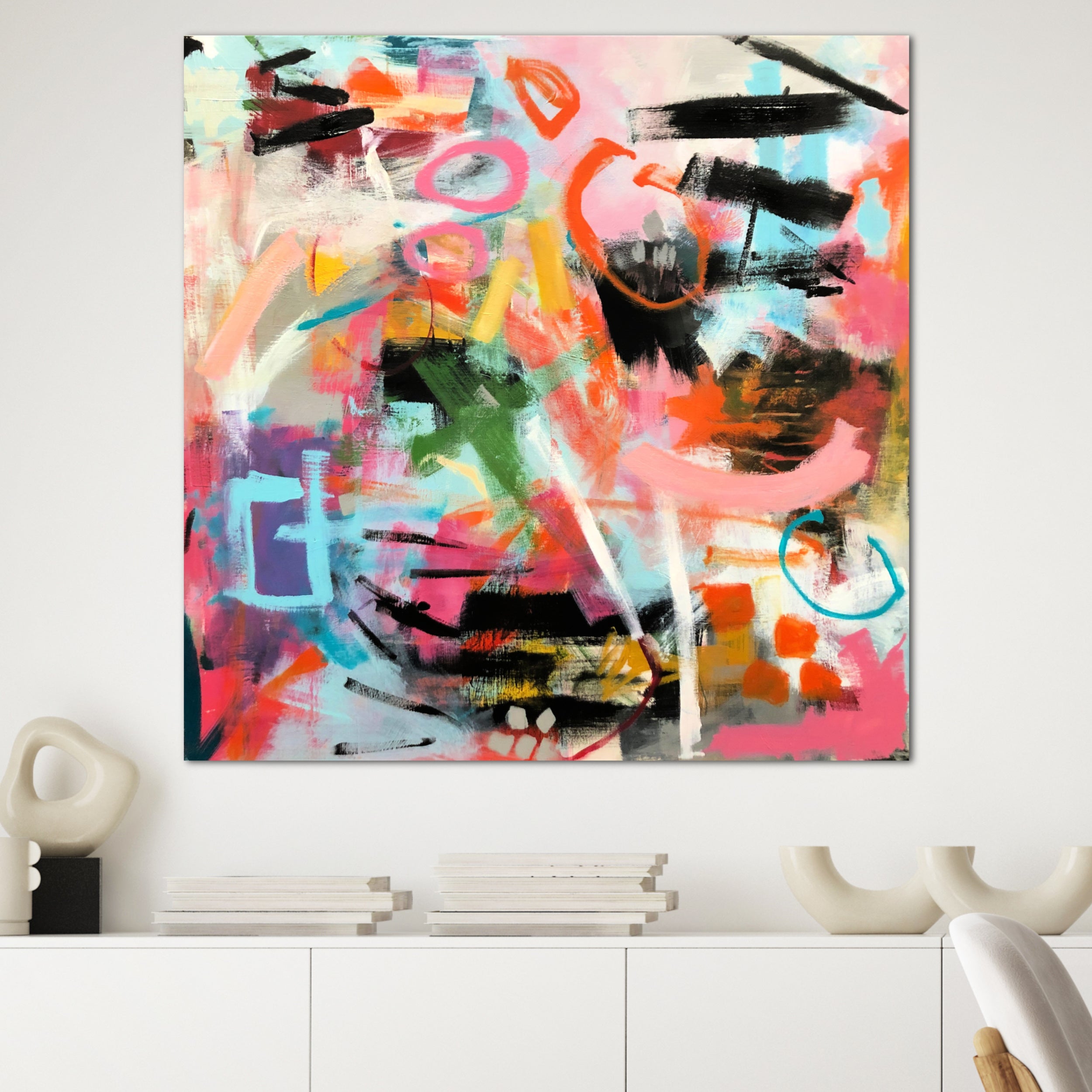 Bright, colourful abstract painting "Freedom" with intuitive, bold mark-making hanging on wall in minimalist white home interior - in situ