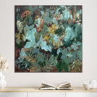 Abstract floral painting on canvas with subtle reference to plants and greenery hanging on wall in neutral interior with natural finishes. 