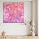 Modern abstract painting 'Happy Land" in pink and purple tones hanging in a neutral, modern interior space