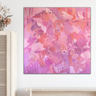 Abstract expressionist painting in pink, salmon and mauve tones hanging in a contemporary interior space with natural timber furnishings