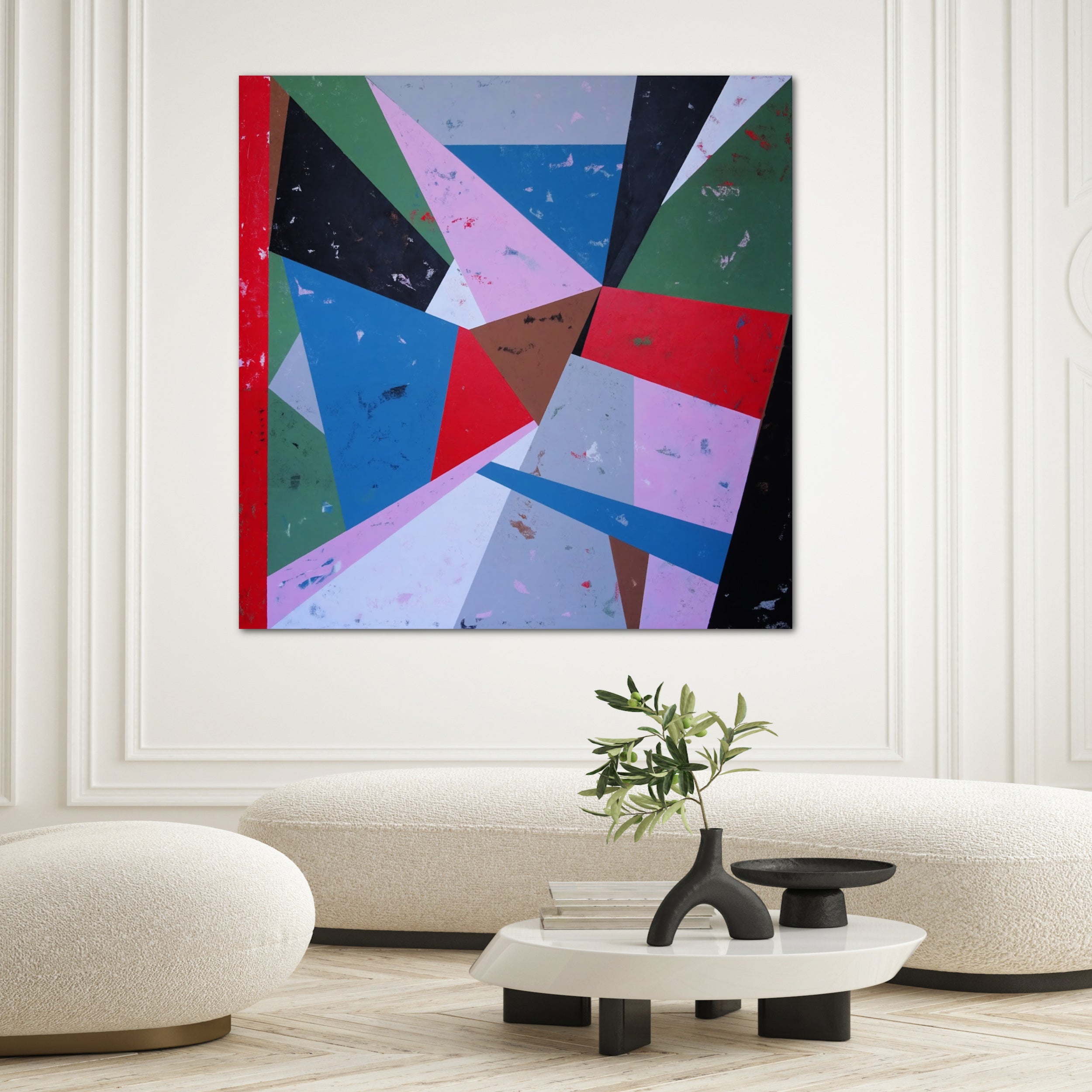 Square abstract painting with geometric pattern in bold colours hanging on wall in luxury living room in a modern home interior - in situ