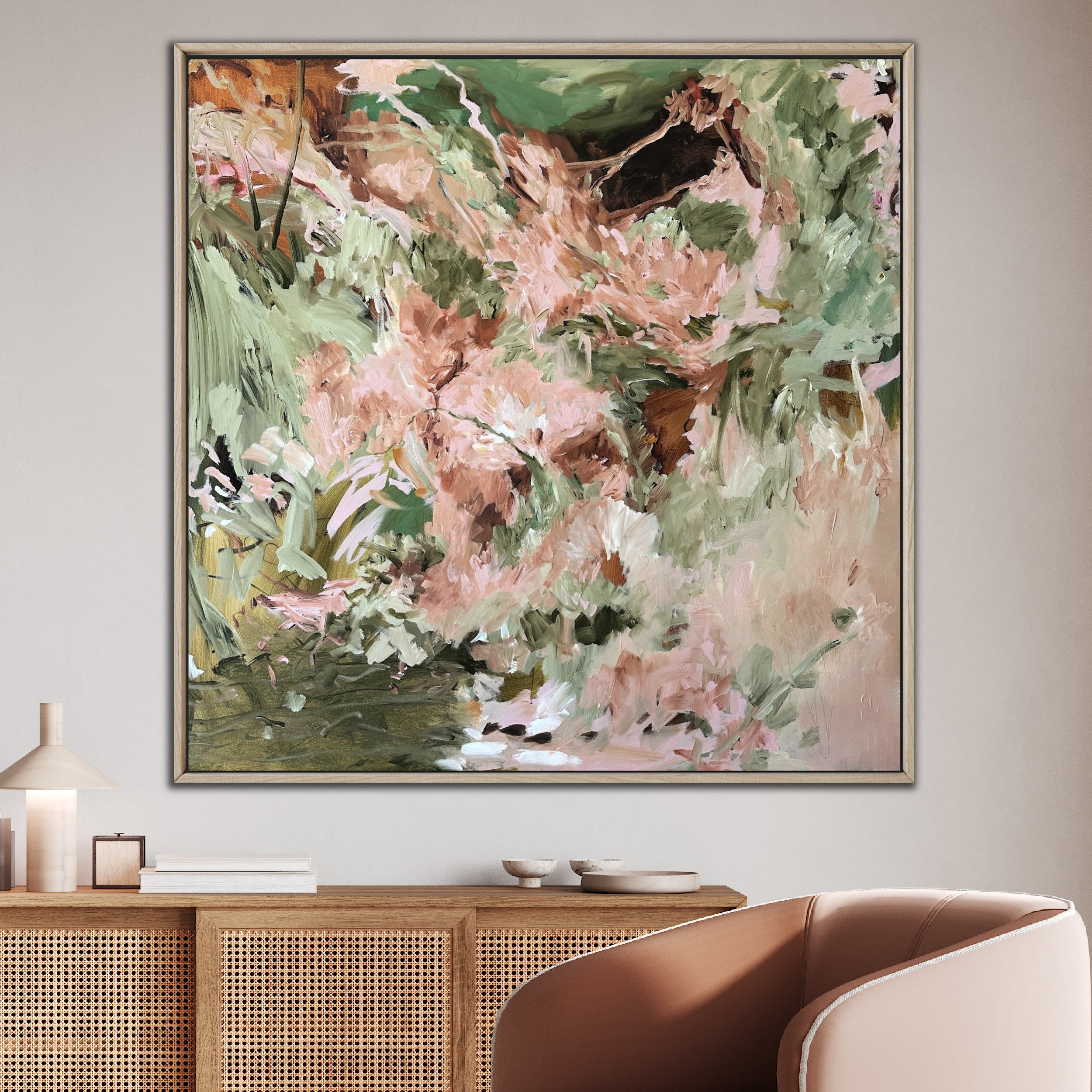 Abstract expressionist painting "Jungle Anthem" that feels energetic and wild, framed in oak and hanging on wall in modern home with neutral decor