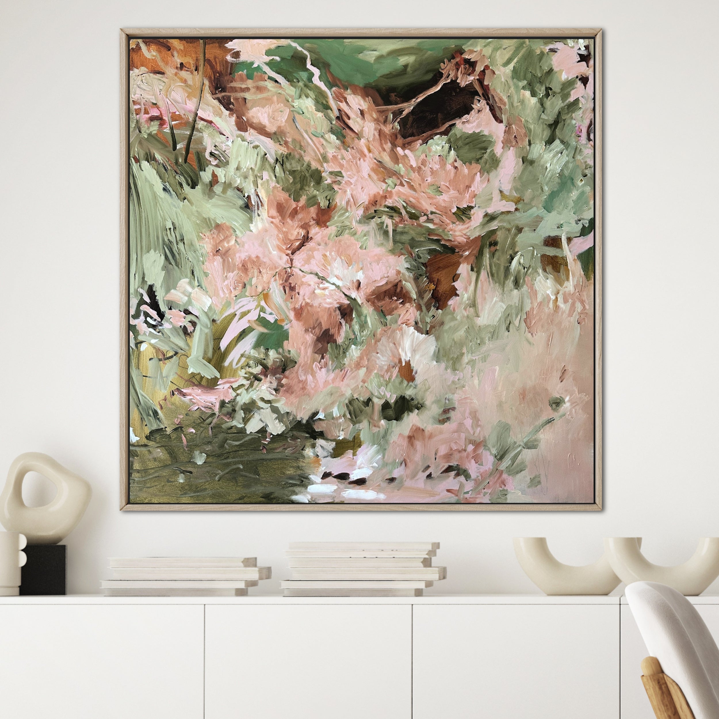 Nature inspired abstract painting in timber frame hanging on wall in minimalist modern home