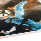 Close-up detail of painted edge of contemporary abstract painting on canvas showing expressive detail