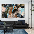 Large black and blue abstract painting hanging above sofa in modern living room with dark furnishings