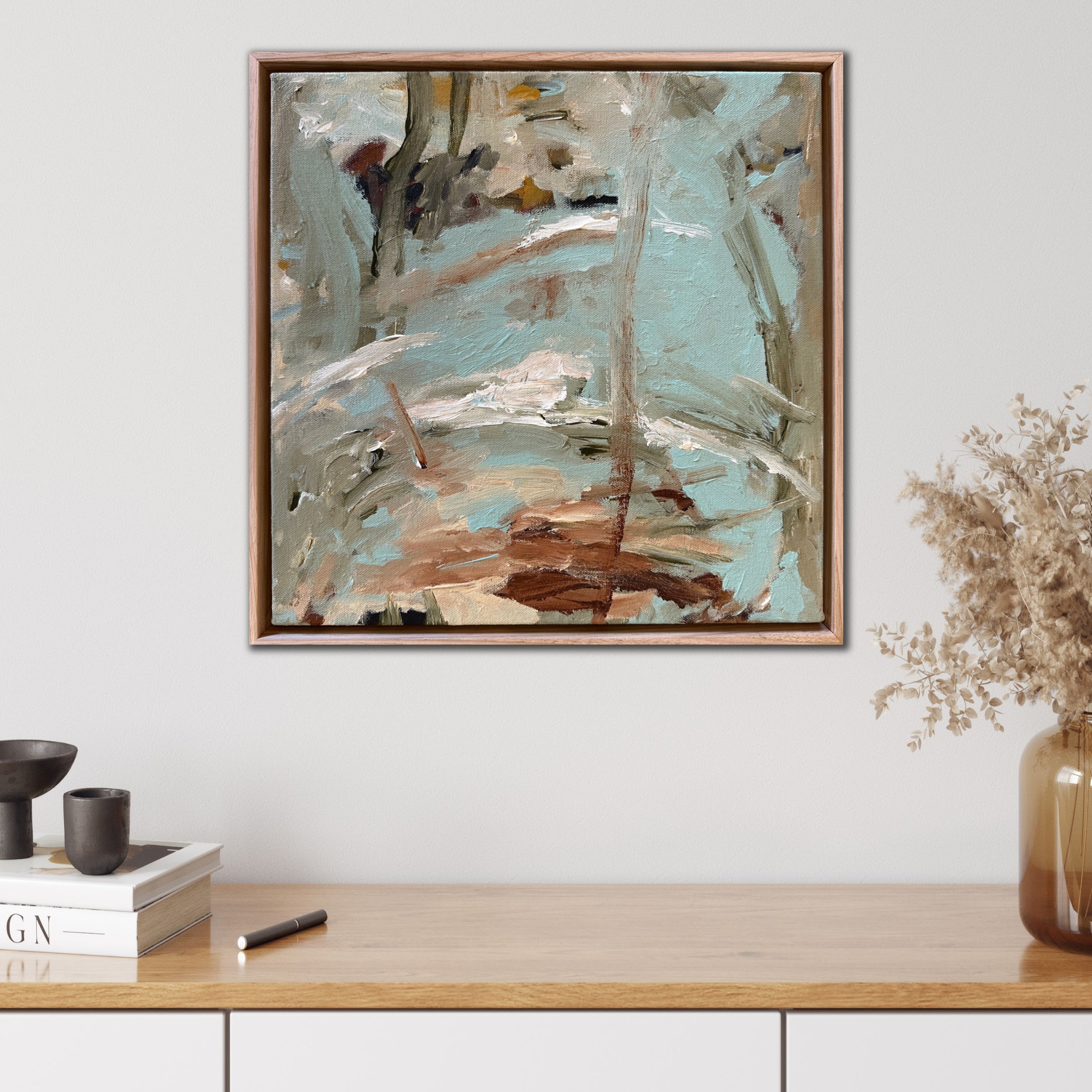 Abstract painting in wood frame, inspired by nature and by a river of water in an Australian outback setting hanging in modern home interior