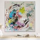 Fun abstract painting in bright colours on square canvas hanging on wall in neutral modern room